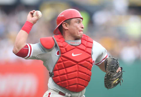 Jun 13, 2015; Pittsburgh, PA, USA; Philadelphia Phillies catcher Carlos Ruiz (51) throws to first base to retire Pittsburgh Pirates pinch hitter Jose Tabata (not pictured) during the sixth inning at PNC Park. The Pirates won 4-3. Mandatory Credit: Charles LeClaire-USA TODAY Sports