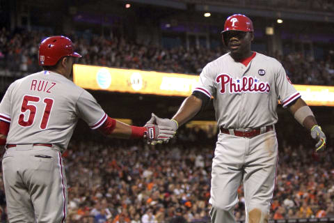 Jul 11, 2015; San Francisco, CA, USA; Philadelphia Phillies catcher Carlos Ruiz (51) greets first baseman Ryan Howard (6) after his solo home run in the sixth inning against the San Francisco Giants at AT&T Park. Mandatory Credit: Lance Iversen-USA TODAY Sports