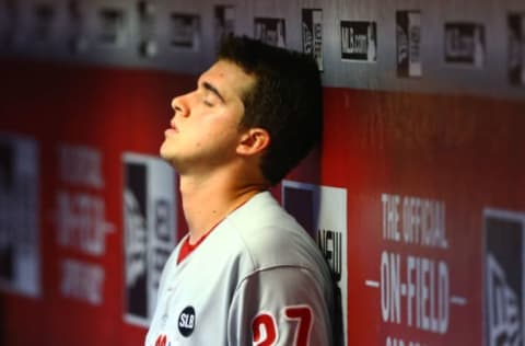 Aug 12, 2015; Phoenix, AZ, USA; Philadelphia Phillies pitcher Aaron Nola reacts in the dugout in the third inning against the Arizona Diamondbacks at Chase Field. Mandatory Credit: Mark J. Rebilas-USA TODAY Sports