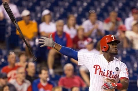 Sep 8, 2015; Philadelphia, PA, USA; Philadelphia Phillies center fielder Odubel Herrera (37) tosses his bat after hitting a three RBI home run during the eighth inning against the Atlanta Braves at Citizens Bank Park. The Phillies won 5-0. Mandatory Credit: Bill Streicher-USA TODAY Sports