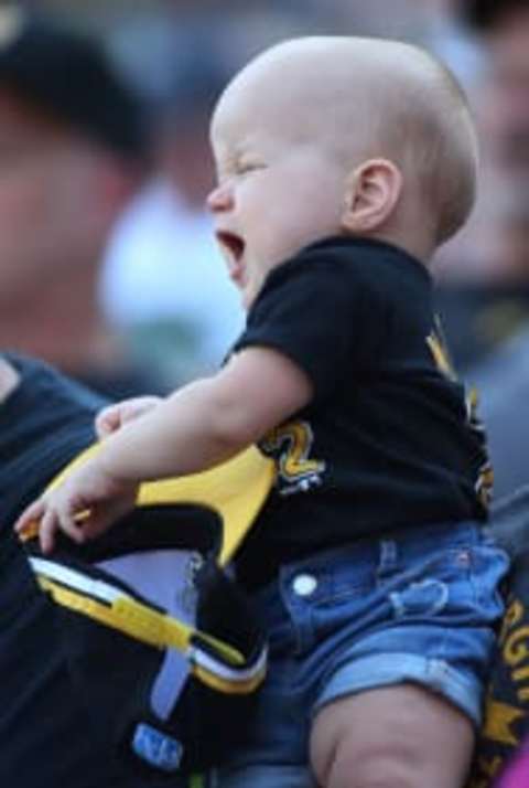 Sep 4, 2016; Pittsburgh, PA, USA; Pittsburgh Pirates fan Noelle Sheafler (1 year old) reacts as the Pirates lose their sixth consecutive game against the Milwaukee Brewers at PNC Park. The Brewers won 10-0. Mandatory Credit: Charles LeClaire-USA TODAY Sports