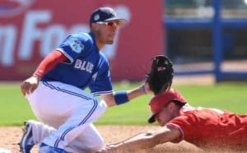 Feb 26, 2017; Dunedin, FL, USA; Toronto Blue Jays infielder Ryan Groins (17) waits for the ball as Philadelphia Phillies outfielder Dylan Cozens (77) slides into second base on a steal attempt in the second inning of the spring training game at Florida Auto Exchange Stadium. Mandatory Credit: Jonathan Dyer-USA TODAY Sports