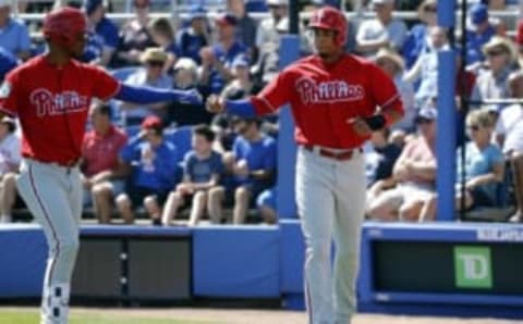 Mar 11, 2017; Dunedin, FL, USA; Philadelphia Phillies designated hitter Aaron Altherr (23) is congratulated by right fielder Nick Williams (65) after scoring against the Toronto Blue Jays during the fourth inning at Florida Auto Exchange Stadium. Mandatory Credit: Kim Klement-USA TODAY Sports