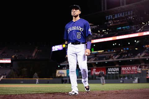 Aug 29, 2016; Denver, CO, USA; Colorado Rockies right fielder Carlos Gonzalez (5) walks to the dugout in the eighth inning against the Los Angeles Dodgers at Coors Field. The Rockies defeated the Dodgers 8-1. Mandatory Credit: Isaiah J. Downing-USA TODAY Sports