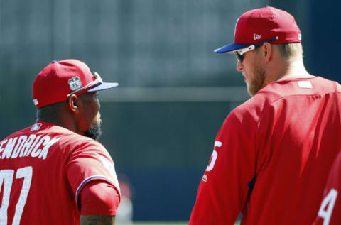 Mar 24, 2017; Tampa, FL, USA; Philadelphia Phillies left fielder Howie Kendrick (47) and right fielder Michael Saunders (5) talk prior to their spring training game against the New York Yankees at George M. Steinbrenner Field. Mandatory Credit: Kim Klement-USA TODAY Sports