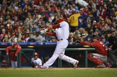 Apr 8, 2017; Philadelphia, PA, USA; Philadelphia Phillies first baseman Tommy Joseph (19) hits an RBI single during the first inning against the Washington Nationals at Citizens Bank Park. Mandatory Credit: John Geliebter-USA TODAY Sports