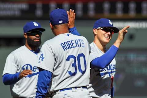 Apr 27, 2017; San Francisco, CA, USA; Los Angeles Dodgers shortstop Enrique Hernandez (14) high fives Los Angeles Dodgers manager Dave Roberts (30) after defeating the San Francisco Giants at AT&T Park. Mandatory Credit: Sergio Estrada-USA TODAY Sports