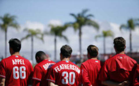 Feb 25, 2017; Clearwater, FL, USA; Philadelphia Phillies starting pitcher Mark Appel (66), shortstop Taylor Featherston (30), relief pitcher Joely Rodriguez (63) and teammates stand during the national anthem before the game against the New York Yankees at Spectrum Field. Mandatory Credit: Kim Klement-USA TODAY Sports