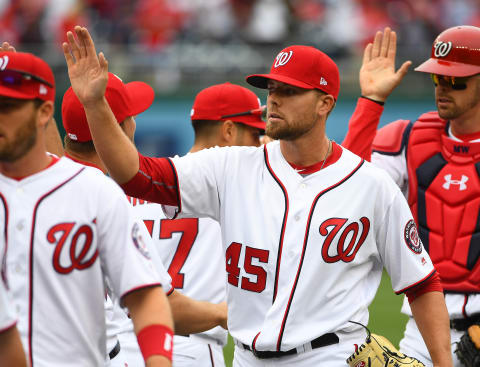 Apr 3, 2017; Washington, DC, USA; Washington Nationals relief pitcher Blake Treinen (45) is congratulated by teammates after earing a save against the Miami Marlins at Nationals Park. Washington Nationals won 4 – 2. Mandatory Credit: Brad Mills-USA TODAY Sports