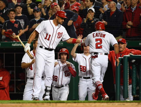 Apr 5, 2017; Washington, DC, USA; Washington Nationals center fielder Adam Eaton (2) is congratulated by first baseman Ryan Zimmerman (11) after scoring a run against the Miami Marlins during the fourth inning at Nationals Park. Mandatory Credit: Brad Mills-USA TODAY Sports