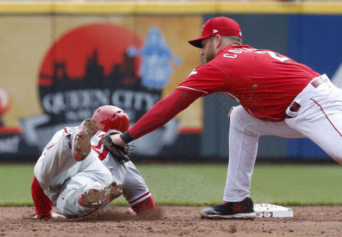 Apr 6, 2017; Cincinnati, OH, USA; Philadelphia Phillies catcher Andrew Knapp (34) is picked off at second base by Cincinnati Reds shortstop Zack Cozart (2) during the sixth inning at Great American Ball Park. Mandatory Credit: David Kohl-USA TODAY Sports