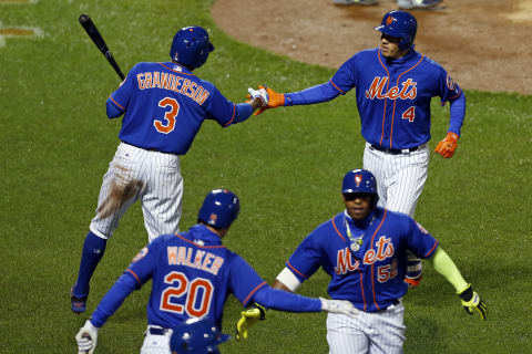 Apr 6, 2017; New York City, NY, USA; New York Mets third baseman Wilmer Flores (4) celebrates with Mets right fielder Curtis Granderson (3) after hitting a two-run home run against the Atlanta Braves during the sixth inning at Citi Field. Mandatory Credit: Adam Hunger-USA TODAY Sports