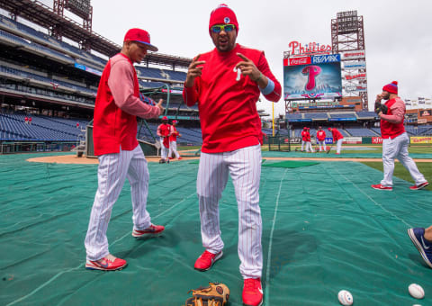 Apr 7, 2017; Philadelphia, PA, USA; Philadelphia Phillies third baseman Andres Blanco (4) reacts to the weather during batting practice before their home opener against the Washington Nationals at Citizens Bank Park. Mandatory Credit: Bill Streicher-USA TODAY Sports