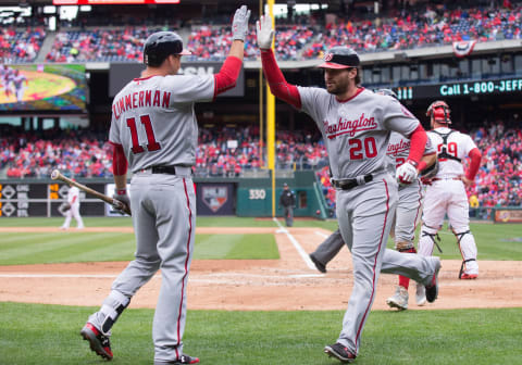 Apr 7, 2017; Philadelphia, PA, USA; Washington Nationals second baseman Daniel Murphy (20) celebrates with first baseman Ryan Zimmerman (11) after hitting a two-run home run during the third inning against the Philadelphia Phillies at Citizens Bank Park. Mandatory Credit: Bill Streicher-USA TODAY Sports