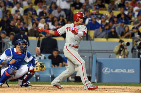 Apr 28, 2017; Los Angeles, CA, USA; Philadelphia Phillies second baseman Cesar Hernandez (16) hits a single against the Los Angeles Dodgers in the third inning at Dodger Stadium. Mandatory Credit: Richard Mackson-USA TODAY Sports