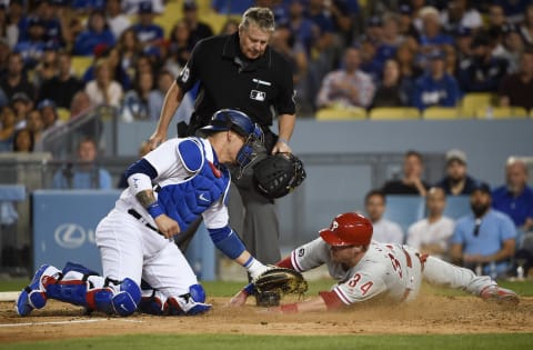 Apr 29, 2017; Los Angeles, CA, USA; Los Angeles Dodgers catcher Yasmani Grandal (9) tags out Philadelphia Phillies catcher Andrew Knapp (34) at home during the sixth inning at Dodger Stadium. Mandatory Credit: Kelvin Kuo-USA TODAY Sports