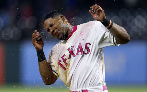 May 13, 2017; Arlington, TX, USA; Texas Rangers shortstop Elvis Andrus (1) reacts after receiving a powerade and sunflower bath after the game against the Oakland Athletics at Globe Life Park in Arlington. Mandatory Credit: Kevin Jairaj-USA TODAY Sports