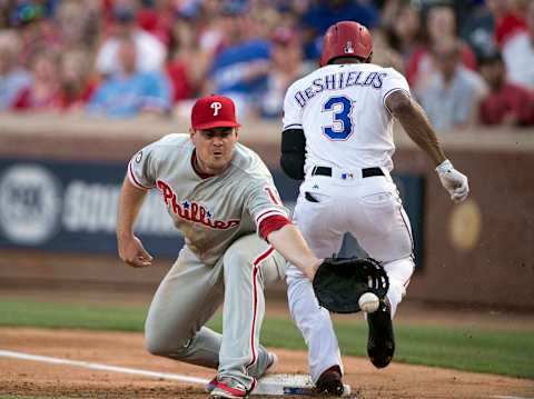 May 17, 2017; Arlington, TX, USA; Philadelphia Phillies first baseman Tommy Joseph (19) mishandles the throw as Texas Rangers left fielder Delino DeShields (3) is safe at first base during the second inning at Globe Life Park in Arlington. Mandatory Credit: Jerome Miron-USA TODAY Sports