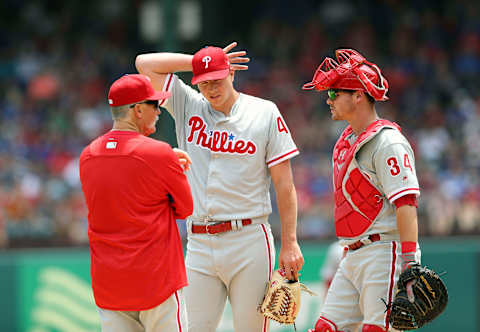 May 18, 2017; Arlington, TX, USA; Philadelphia Phillies pitching coach Bob McClure (22) speaks with starting pitcher Nick Pivetta (43) and catcher Andrew Knapp (34) during the third inning against the Texas Rangers at Globe Life Park in Arlington. Mandatory Credit: Kevin Jairaj-USA TODAY Sports