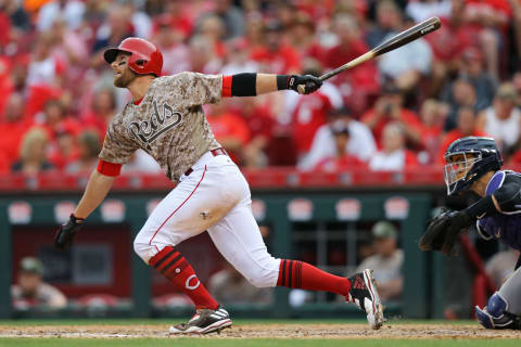 May 20, 2017; Cincinnati, OH, USA; Cincinnati Reds shortstop Zack Cozart (2) hits an RBI sacrifice fly against the Colorado Rockies in the seventh inning at Great American Ball Park. Mandatory Credit: Aaron Doster-USA TODAY Sports