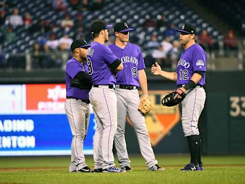 May 22, 2017; Philadelphia, PA, USA; Colorado Rockies shortstop Alexi Amarista (2) and third baseman Nolan Arenado (28) and second baseman DJ LeMahieu (9) and first baseman Mark Reynolds (12) talk during an officials review during the eighth inning against the Philadelphia Phillies at Citizens Bank Park. The Rockies defeated the Phillies 8-1. Mandatory Credit: Eric Hartline-USA TODAY Sports