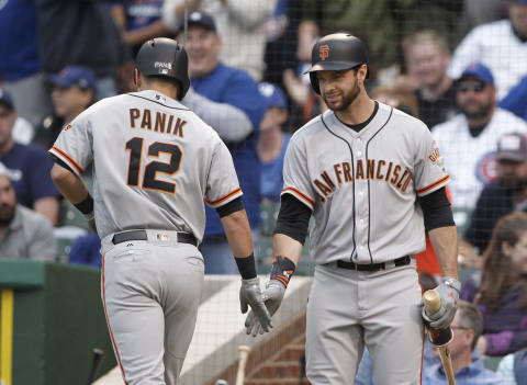 May 22, 2017; Chicago, IL, USA; San Francisco Giants second baseman Joe Panik (12) celebrates with first baseman Brandon Belt (9) after hitting a solo home run during the first inning against the Chicago Cubs at Wrigley Field. Mandatory Credit: Caylor Arnold-USA TODAY Sports