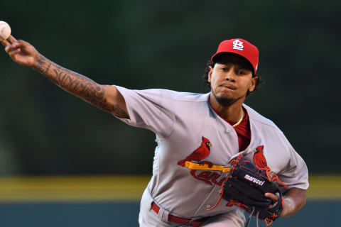 May 26, 2017; Denver, CO, USA; St. Louis Cardinals starting pitcher Carlos Martinez (18) delivers a pitch in the first inning against the Colorado Rockies at Coors Field. Mandatory Credit: Ron Chenoy-USA TODAY Sports