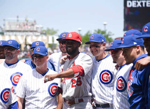 Jun 2, 2017; Chicago, IL, USA; St. Louis Cardinals center fielder Dexter Fowler (25) poses for a photo with the Chicago Cubs as he he received his 2016 World Series championship ring before the game at Wrigley Field. Mandatory Credit: David Banks-USA TODAY Sports