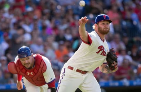 Jun 3, 2017; Philadelphia, PA, USA; Philadelphia Phillies starting pitcher Ben Lively (49) fields a ground ball for an out in past catcher Andrew Knapp (34) during the fourth inning against the San Francisco Giants at Citizens Bank Park. Mandatory Credit: Bill Streicher-USA TODAY Sports