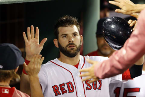 Jun 10, 2017; Boston, MA, USA; Boston Red Sox first baseman Mitch Moreland (18) is congratulate in the dugout after scoring against the Detroit Tigers during the seventh inning at Fenway Park. Mandatory Credit: Winslow Townson-USA TODAY Sports