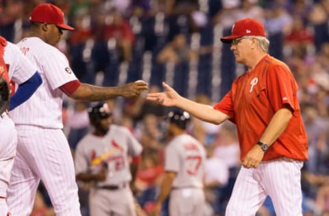 Jun 20, 2017; Philadelphia, PA, USA; Philadelphia Phillies manager Pete Mackanin (45) takes the ball from relief pitcher Edubray Ramos (61) during the eleventh inning against the St. Louis Cardinals at Citizens Bank Park. Mandatory Credit: Bill Streicher-USA TODAY Sports