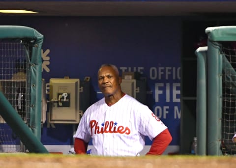 Jun 21, 2017; Philadelphia, PA, USA; Philadelphia Phillies third base coach Juan Samuel (8) watches from the dugout after Philadelphia Phillies center fielder Odubel Herrera (not pictured) was called out at home during the ninth inning against the St. Louis Cardinals at Citizens Bank Park. The Cardinals won 7-6 in 10 innings. Mandatory Credit: Eric Hartline-USA TODAY Sports