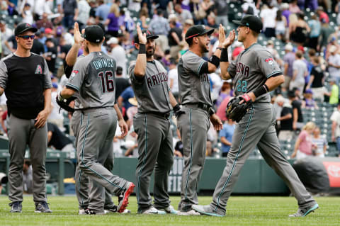 Jun 22, 2017; Denver, CO, USA; Arizona Diamondbacks second baseman Chris Owings (16) and third baseman Jake Lamb (22) celebrate down the line with center fielder Gregor Blanco (5) and left fielder Daniel Descalso (3) after the game at Coors Field. Mandatory Credit: Isaiah J. Downing-USA TODAY Sports