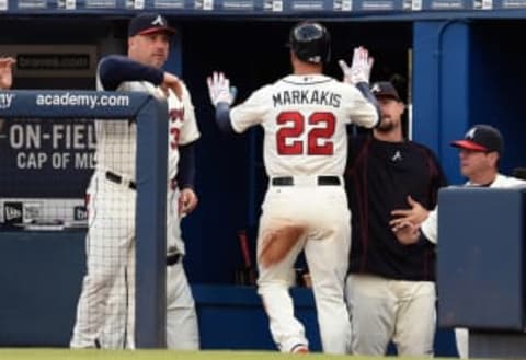 Sep 12, 2015; Atlanta, GA, USA; Atlanta Braves right fielder Nick Markakis (22) is greeted by manager 