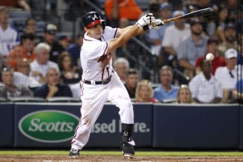 Aug 4, 2015; Atlanta, GA, USA; Atlanta Braves shortstop Daniel Castro (11) hits an infield single against the San Francisco Giants in the seventh inning at Turner Field. Mandatory Credit: Brett Davis-USA TODAY Sports