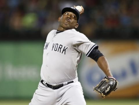 Jul 28, 2015; Arlington, TX, USA; New York Yankees relief pitcher Jose Ramirez (65) delivers to the Texas Rangers during the second inning of a baseball game at Globe Life Park in Arlington. Mandatory Credit: Jim Cowsert-USA TODAY Sports