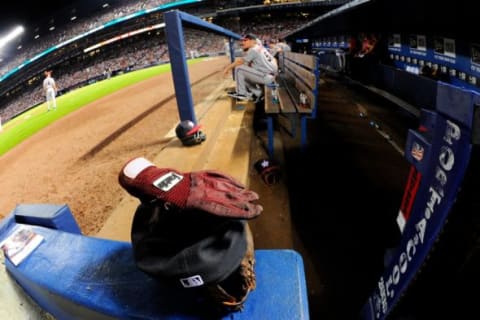 Jul 4, 2014; Atlanta, GA, USA; The glove, cap, and batting glove of Arizona Diamondbacks third baseman Martin Prado (14) in the dugout during the game against the Atlanta Braves at Turner Field. The Braves defeated the Diamondbacks 5-2. Mandatory Credit: Dale Zanine-USA TODAY Sports