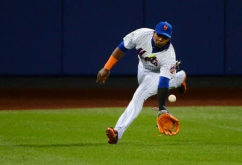 Oct 31, 2015; New York City, NY, USA; New York Mets center fielder Yoenis Cespedes fields a ball hit for a double by Kansas City Royals catcher Salvador Perez (not pictured) in the fifth inning in game four of the World Series at Citi Field. Mandatory Credit: Jeff Curry-USA TODAY Sports