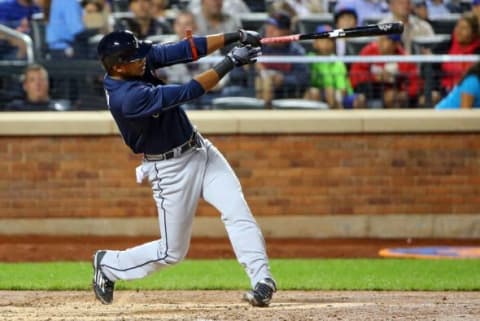 Sep 22, 2015; New York City, NY, USA; Atlanta Braves third baseman Hector Olivera (28) hits a three run home run during the fifth inning against the New York Mets at Citi Field. Mandatory Credit: Anthony Gruppuso-USA TODAY Sports