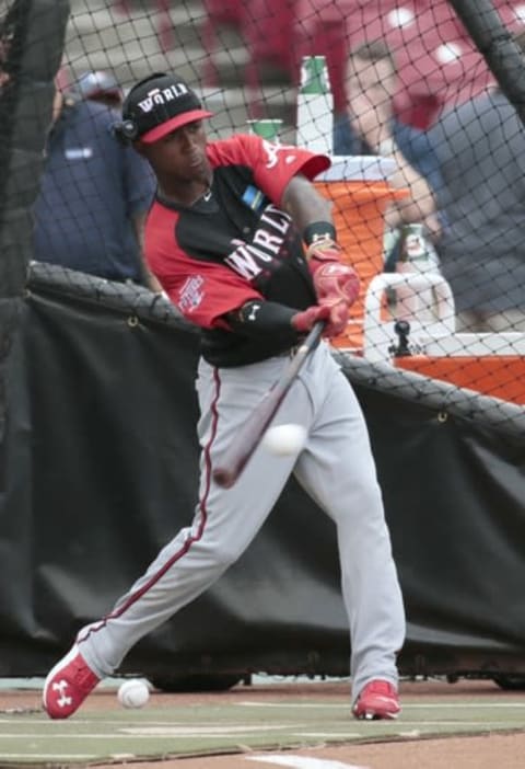 Jul 12, 2015; Cincinnati, OH, USA; World Team infielder Ozhaino Albies hits during batting practice before the All Star Futures Game with the U.S. Team at Great American Ballpark. Mandatory Credit: David Kohl-USA TODAY Sports