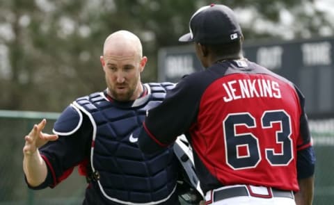 Feb 23, 2015; Lake Buena Vista, FL, USA; Atlanta Braves catcher John Buck talks with pitcher Tyrell Jenkins during spring training workouts at Champion Stadium. Mandatory Credit: Reinhold Matay-USA TODAY Sports