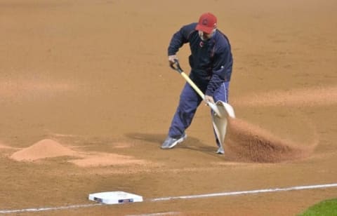 Oct 3, 2015; Cleveland, OH, USA; Cleveland Indians head groundskeeper Brandon Koehnke works on the infield in the fifth inning at Progressive Field. Mandatory Credit: David Richard-USA TODAY Sports