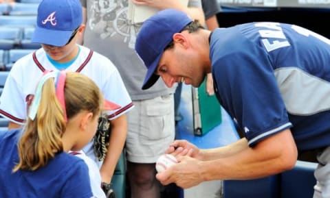 Jul 25, 2014; Atlanta, GA, USA; San Diego Padres outfielder Jeff Francoeur (15) signs autographs for fans prior to the game against the Atlanta Braves at Turner Field. Mandatory Credit: Dale Zanine-USA TODAY Sports