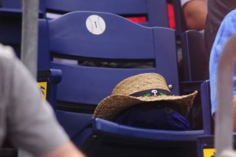 Mar 5, 2014; Clearwater, FL, USA; A hat sits in an empty seat in honor of the late Jim Fregosi, Sr., before the Philadelphia Phillies play the Atlanta Braves at Brighthouse Networks Field. Mandatory Credit: David Manning-USA TODAY Sports