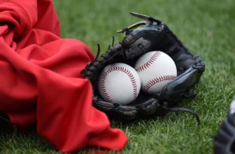 Oct 5, 2014; Kansas City, MO, USA; A general view of baseballs and a glove prior to game three of the 2014 ALDS baseball playoff game between the Kansas City Royals and Los Angeles Angeles at Kauffman Stadium. Mandatory Credit: Peter G. Aiken-USA TODAY Sports