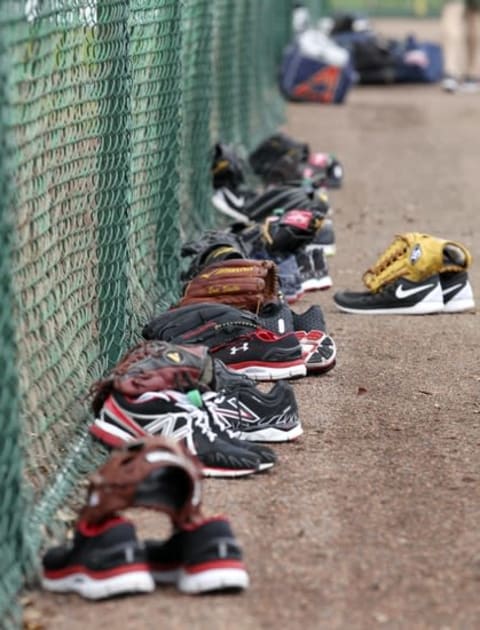 Feb 23, 2015; Lake Buena Vista, FL, USA; Atlanta Braves pitchers equipment lies at the base of the fence during spring training workouts at Champion Stadium. Mandatory Credit: Reinhold Matay-USA TODAY Sports