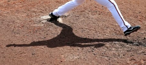 Mar 16, 2016; Lake Buena Vista, FL, USA; The shadow of Atlanta Braves relief pitcher Kyle Kinman on the mound as he pitches against the St. Louis Cardinals during the seventh inning at Champion Stadium. Mandatory Credit: Butch Dill-USA TODAY Sports