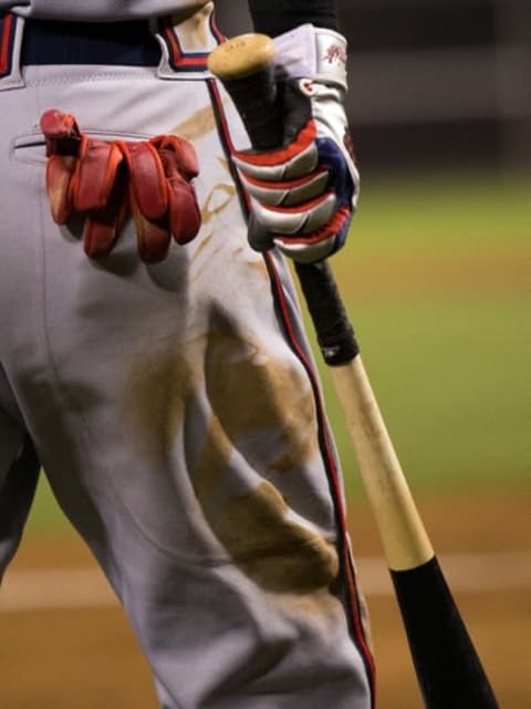 Sep 9, 2015; Philadelphia, PA, USA; The batting glove and bat of Atlanta Braves first baseman Nick Swisher (23) as he waits on deck against the Philadelphia Phillies at Citizens Bank Park. The Braves won 8-1. Mandatory Credit: Bill Streicher-USA TODAY Sports