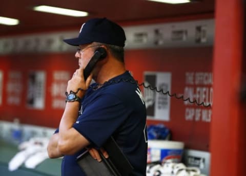 Jun 2, 2015; Phoenix, AZ, USA; Atlanta Braves pitching coach Roger McDowell talks on the dugout phone with the bullpen against the Arizona Diamondbacks at Chase Field. Mandatory Credit: Mark J. Rebilas-USA TODAY Sports