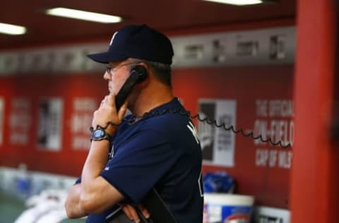 Jun 2, 2015; Phoenix, AZ, USA; Atlanta Braves pitching coach Roger McDowell talks on the dugout phone with the bullpen against the Arizona Diamondbacks at Chase Field. Mandatory Credit: Mark J. Rebilas-USA TODAY Sports